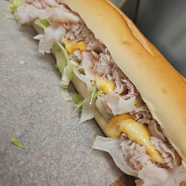 #3 Sliced Turkey Breast, Melted Muenster Cheese Sandwich.